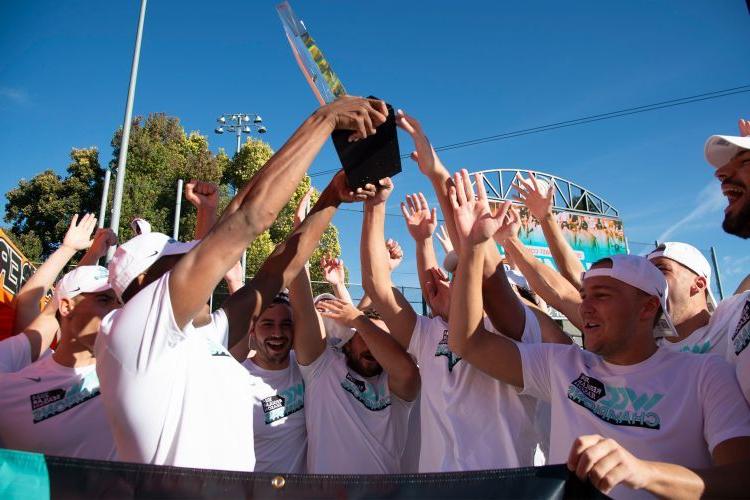 The water polo team celebrates their win after the game.